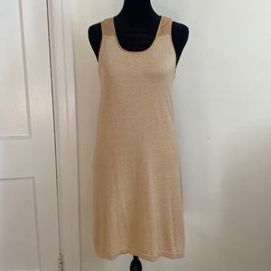Super cute gold and tan sleeveless dress. Has a cute slit in back and is lined!